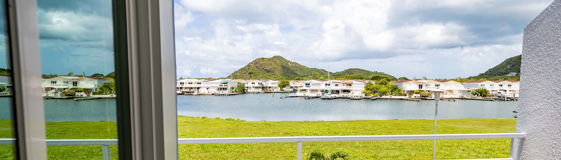View of harbor and mountains from window