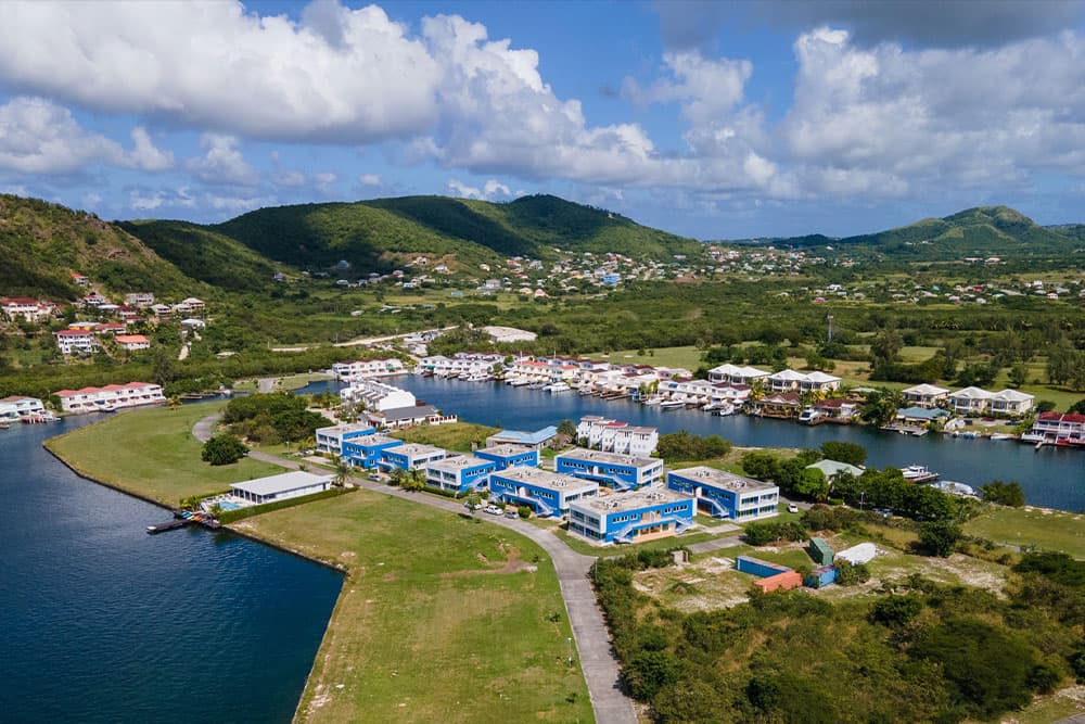 Beautiful view of Jolly Harbour in Antigua and Barbuda with mountains in background.