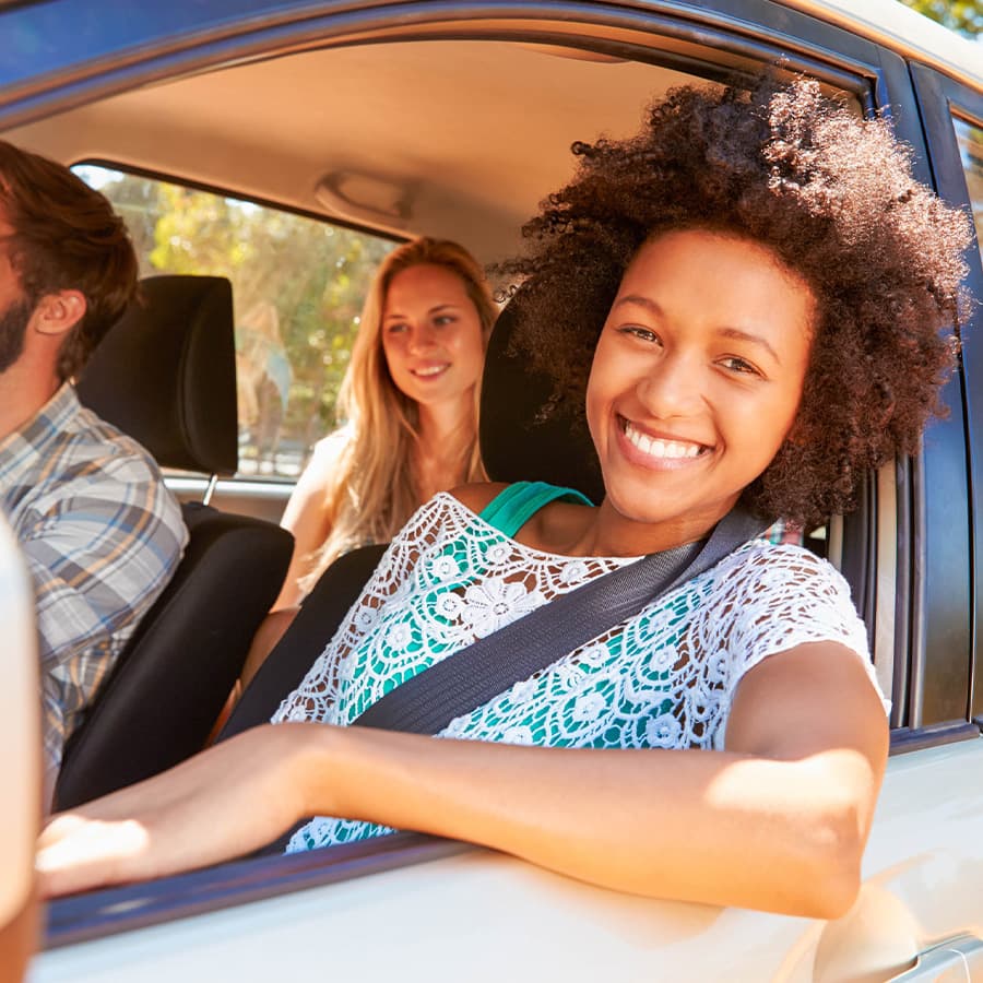 Happy passengers in rental car